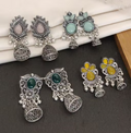 These stunning oxidized silver jhumkas feature vibrant red, green, and pink hues, perfect for festive occasions. Their intricate designs complement any outfit, adding a touch of elegance and tradition,